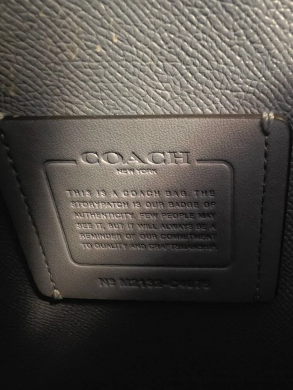 Coach Tatum Carryall in Signature Canvas with marble blue leather handles.